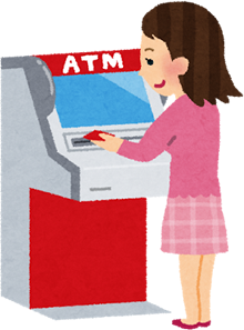 ATMを操作する女性